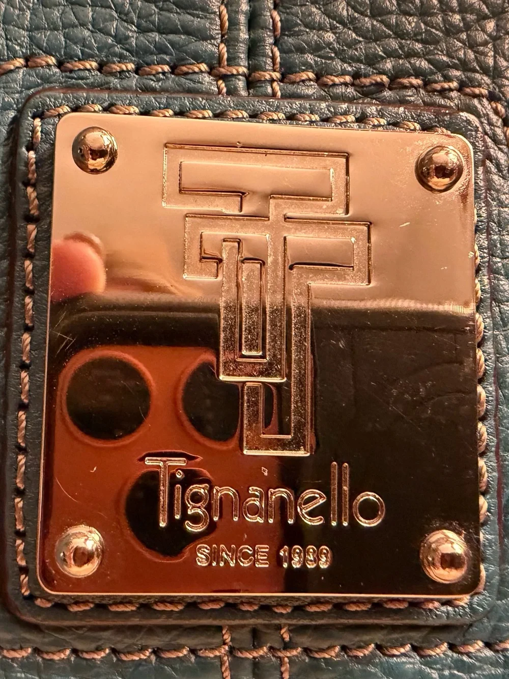 Tignanello teal blue pebbled leather satchel with silver toned hardware.